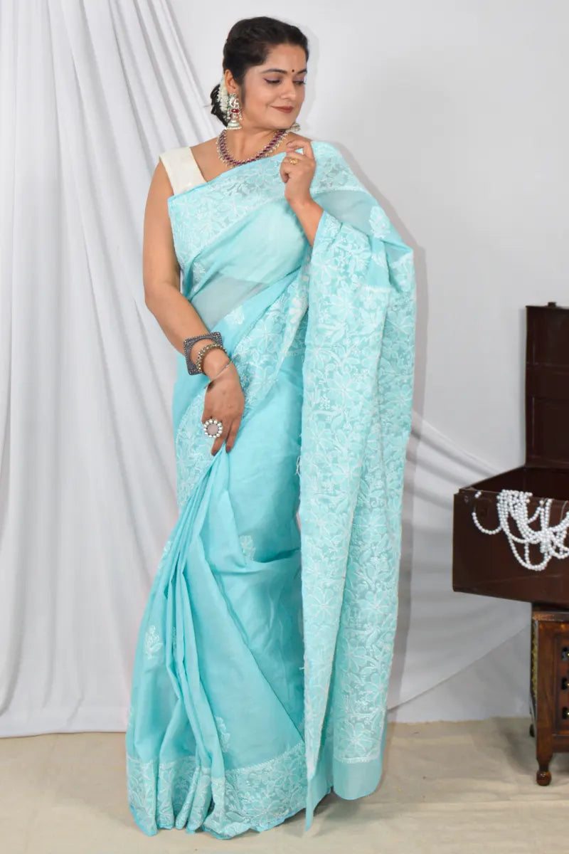 Handcrafted Sky Blue Border Palla Cotton saree with intricate Lucknowi Chikankari embroidery and a matching blouse, ideal for festive and wedding .