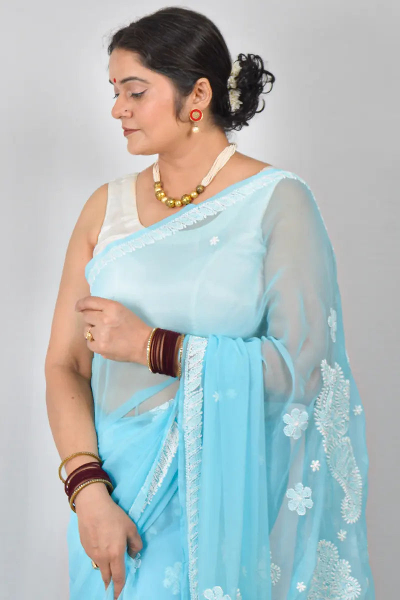 Sky blue Georgette saree with hand-embroidered Lucknowi Chikankari and matching blouse – MeMaana handcrafted ethnic wear.