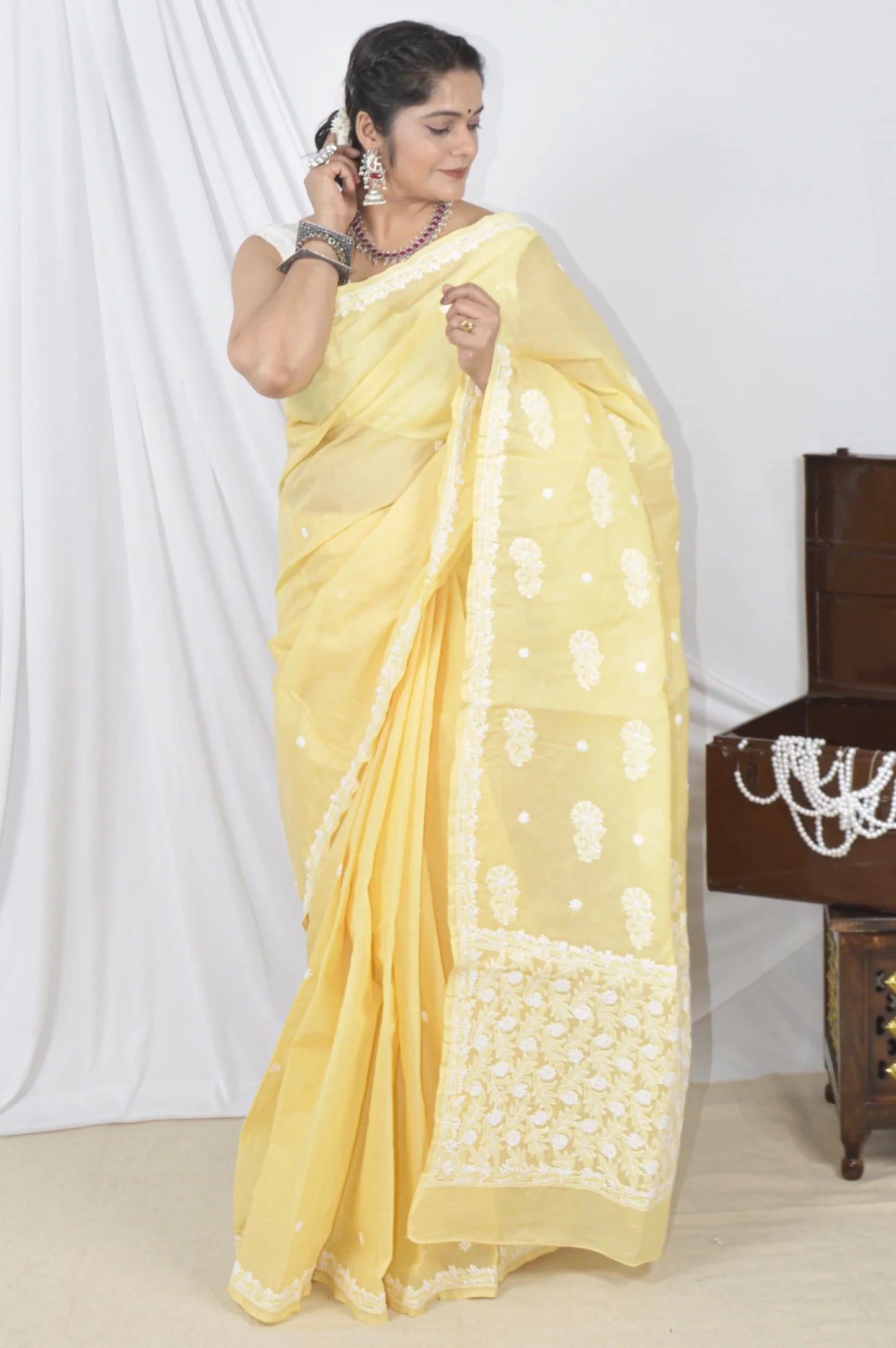 Handcrafted Yellow Designer Cotton saree with intricate Lucknowi Chikankari embroidery and a matching blouse, ideal for festive and wedding .