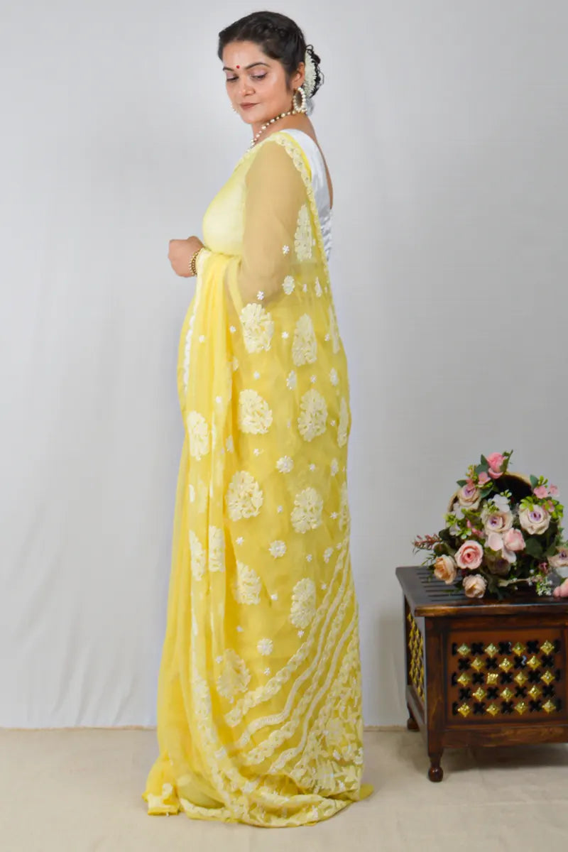 Yellow georgette saree with allover Lucknowi Chikankari and matching blouse – handcrafted festive wear by MeMaana.