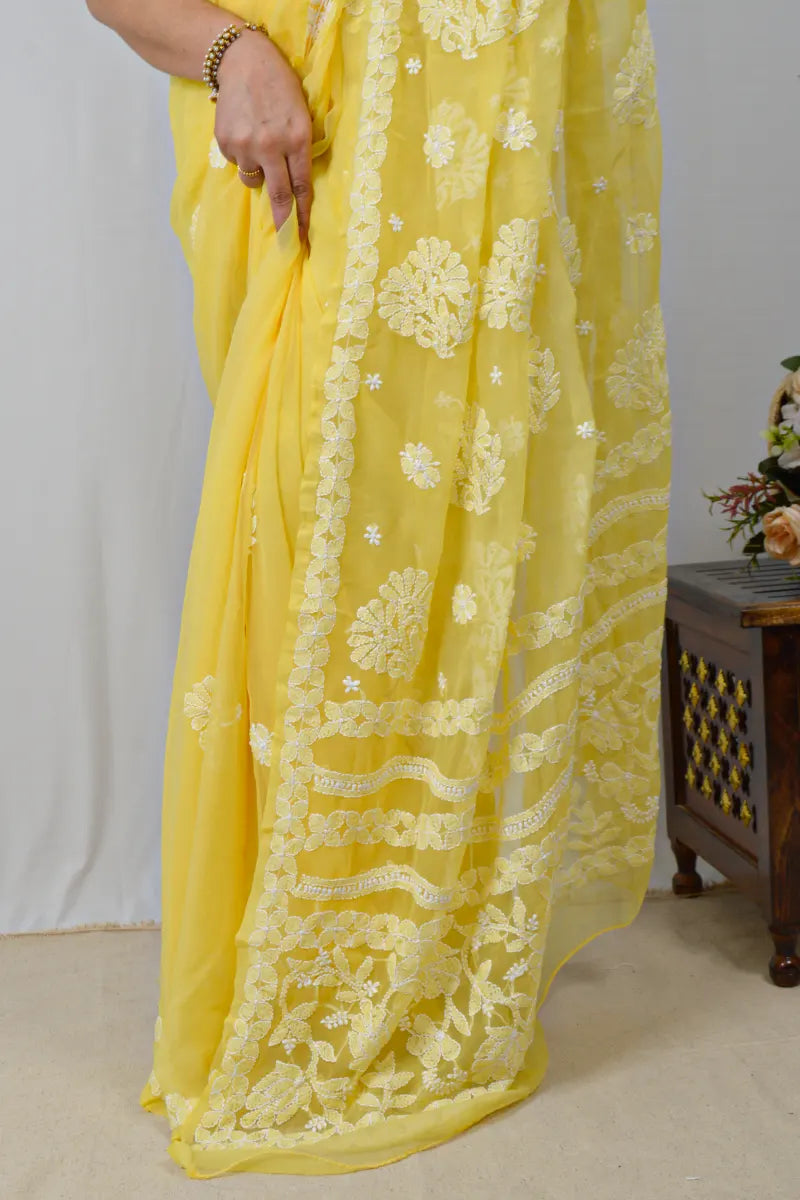 Yellow georgette saree with allover Lucknowi Chikankari and matching blouse – handcrafted festive wear by MeMaana.