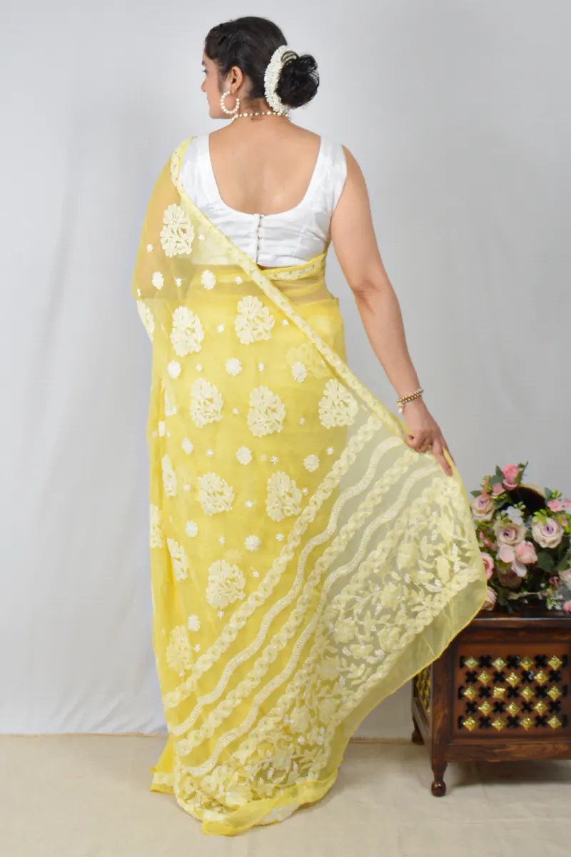 Yellow georgette saree with allover Lucknowi Chikankari and matching blouse – handcrafted festive wear by MeMaana.