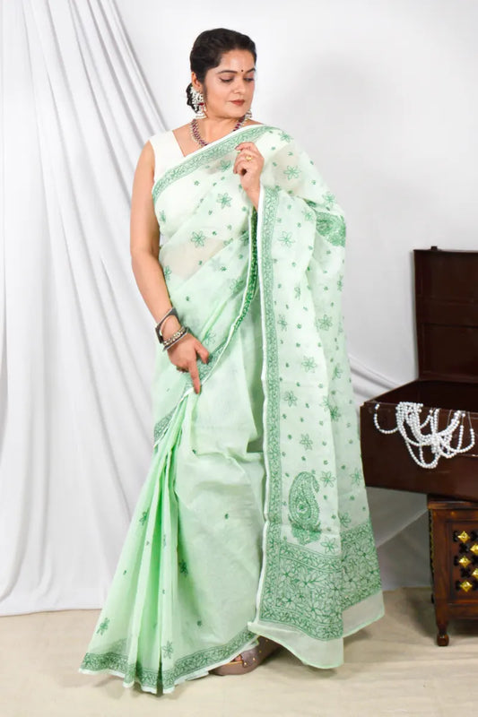 Handcrafted Green Kota Cotton Designer saree with intricate Lucknowi Chikankari embroidery and a matching blouse, ideal for festive and wedding occasions.