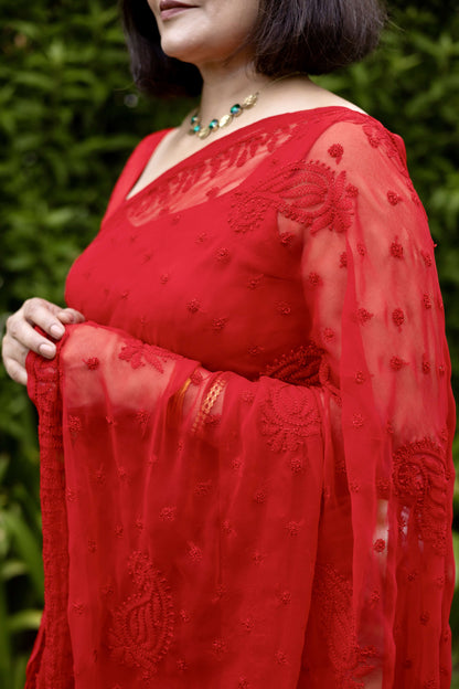 Detailed view of red chikankari embroidered sleeve on georgette saree blouse