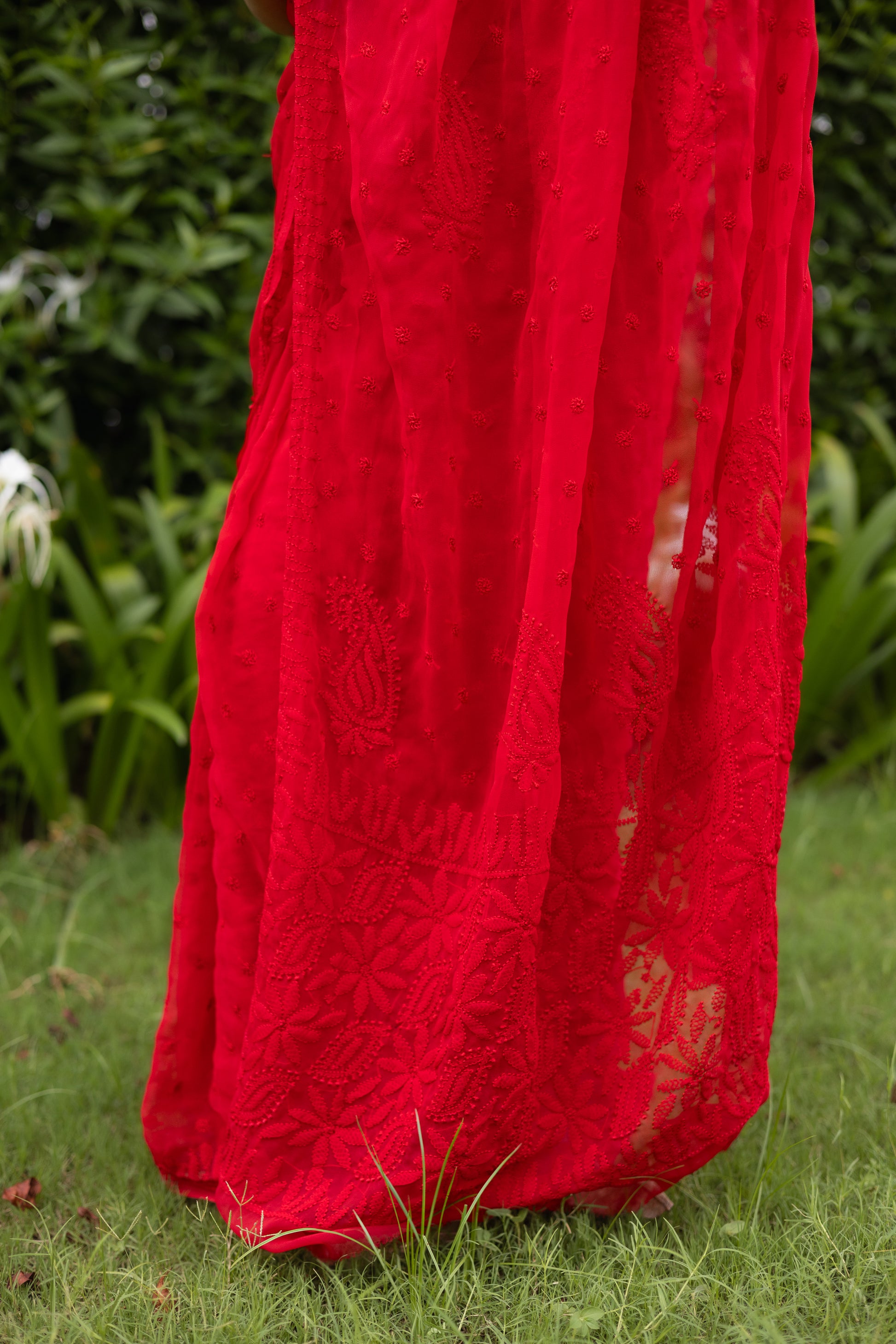 Allover Lucknowi chikankari floral embroidery pattern on red georgette saree pallu