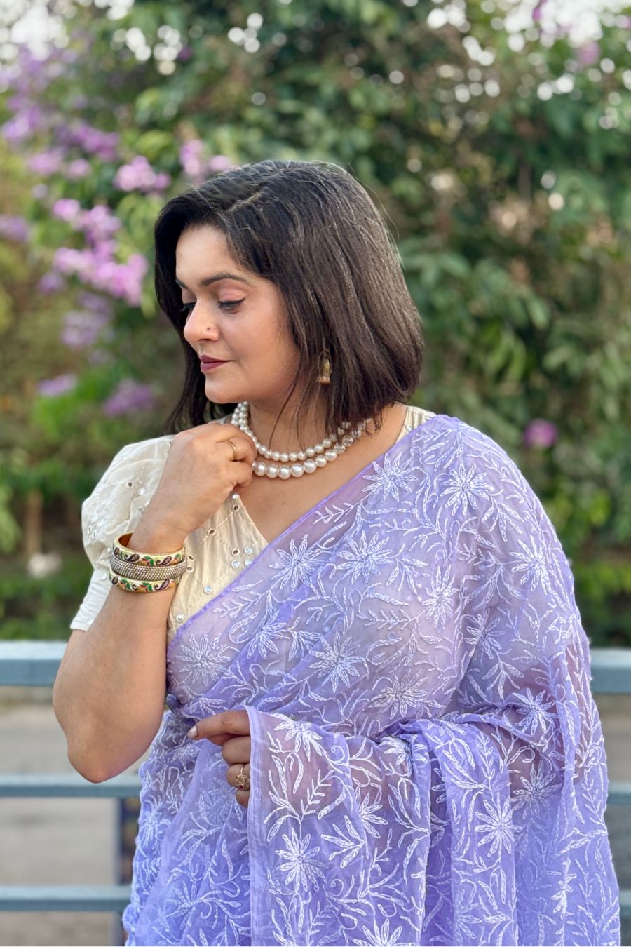 Elegant pastel saree styling with pearl jewelry look